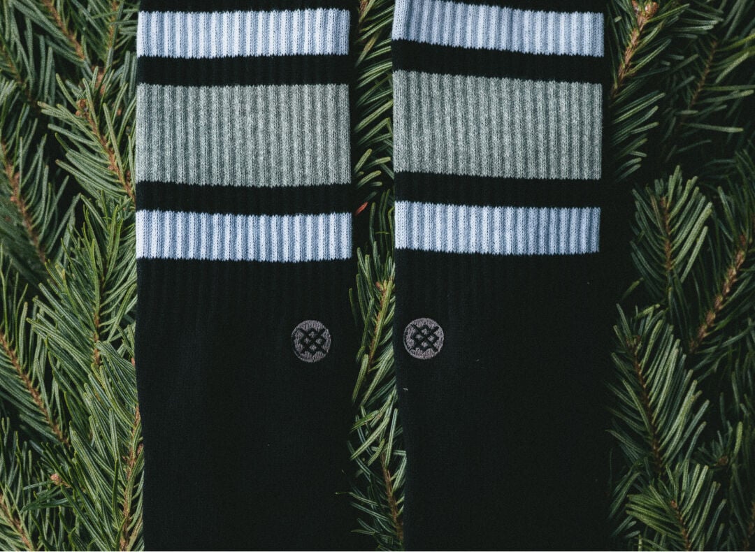 Black Boyd socks on top of a christmas tree